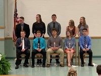 Incoming NHS Officers receive the passing of the torch from their retired 18-19 officers.